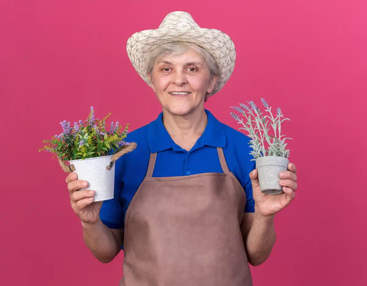 Elderly Dutch woman gardening with hand tools