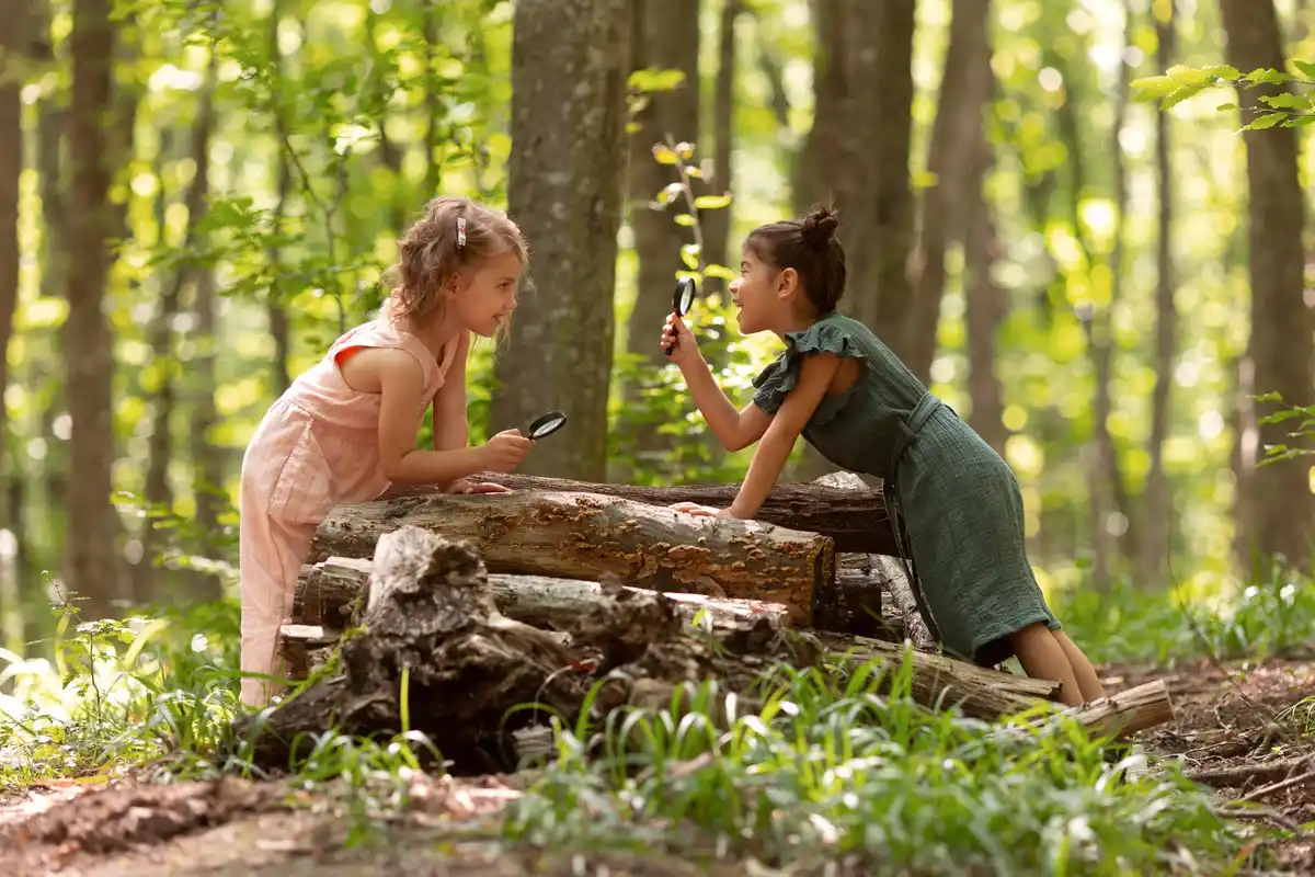 children collecting snails in Dutch backyard