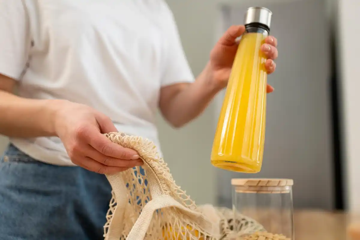 homemade vinegar insect repellent on kitchen counter