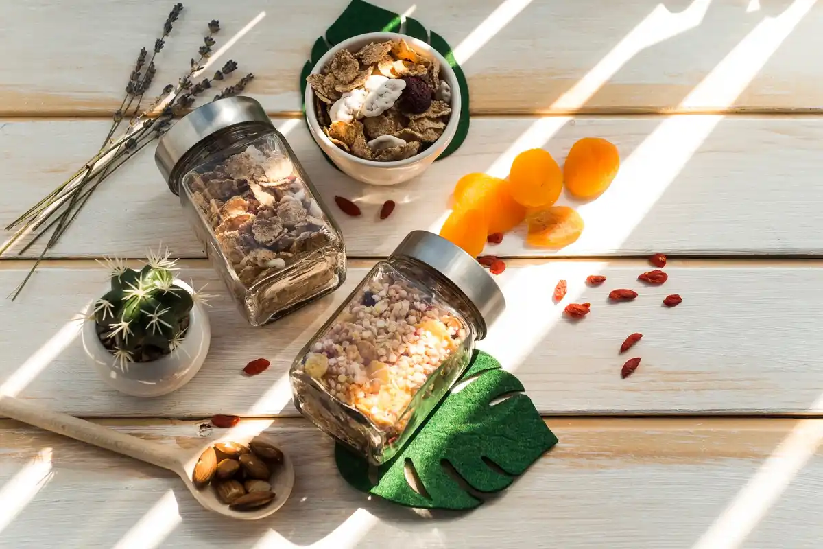close up of seeds stored in glass jars with dates written on them