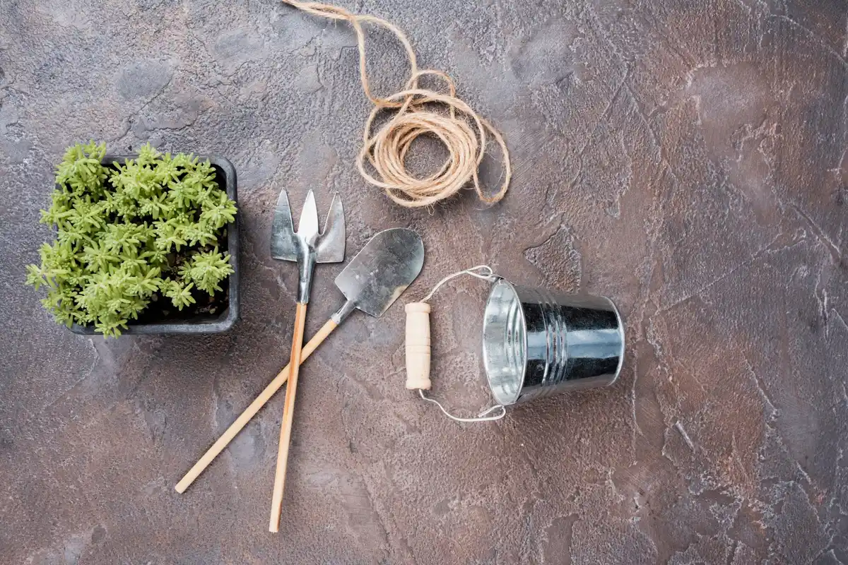 garden tools cleaning with sand and oil in bucket