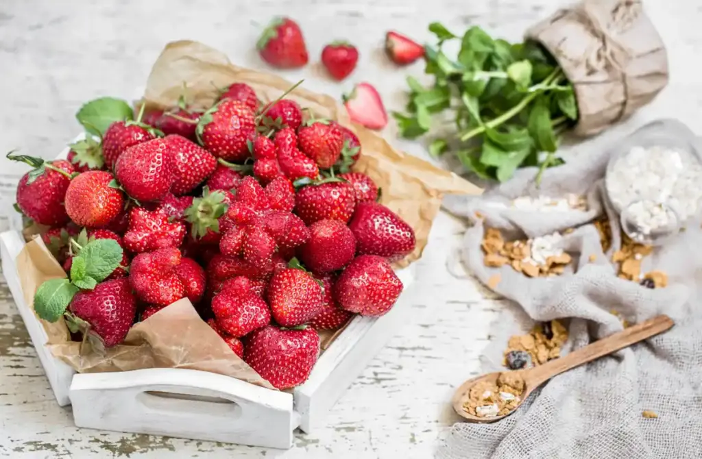 strawberries and roses in garden