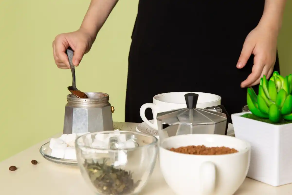 planting seeds with coffee grounds in pot