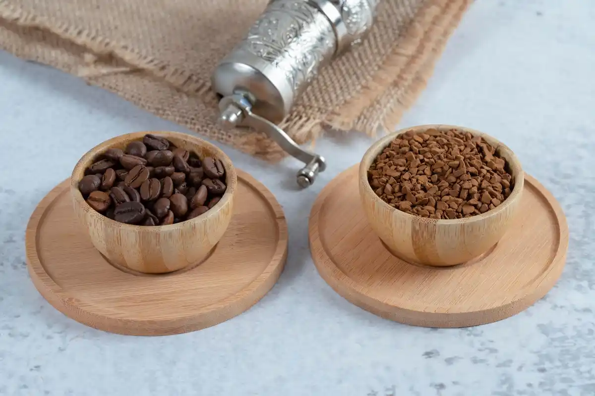 fresh used coffee grounds on houseplant soil close up