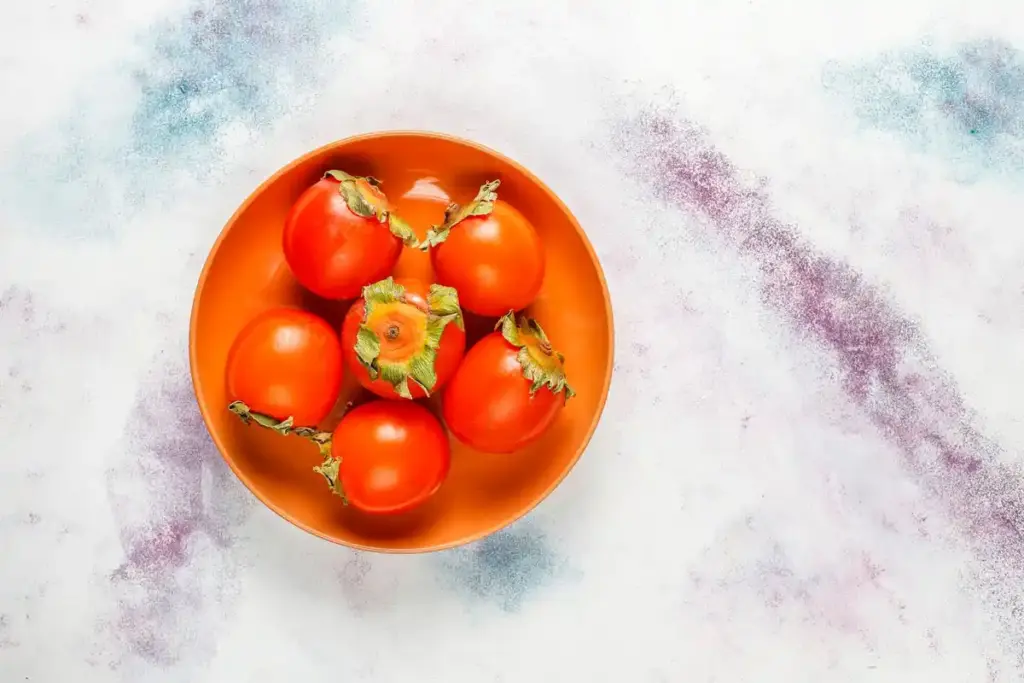 overripe tomato seeds extraction close up kitchen