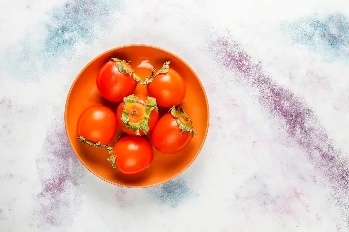 overripe tomato seeds extraction close up kitchen