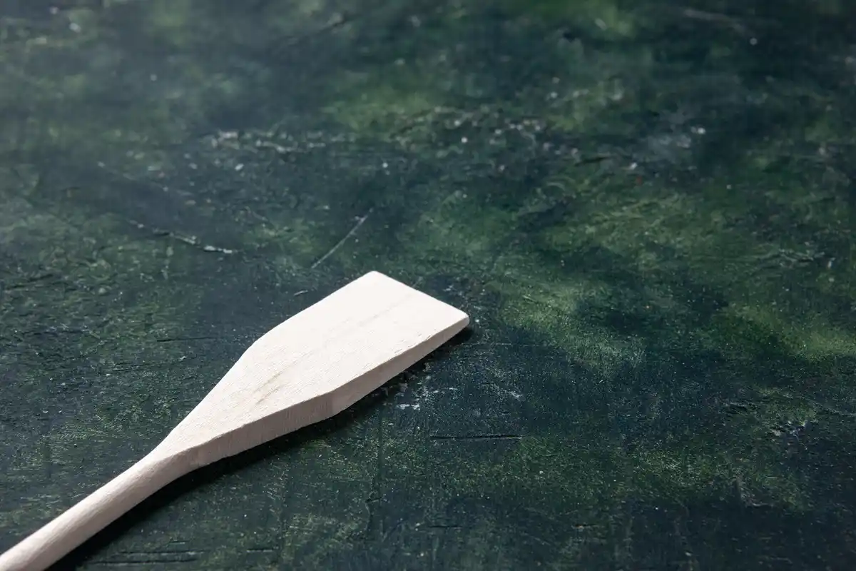 moldy wooden garden tool handle close-up