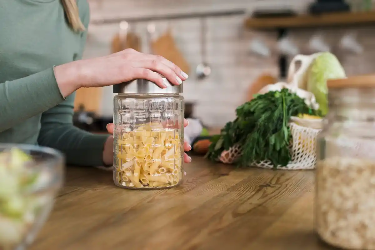 homemade seed storage in glass jars inside refrigerator laying down