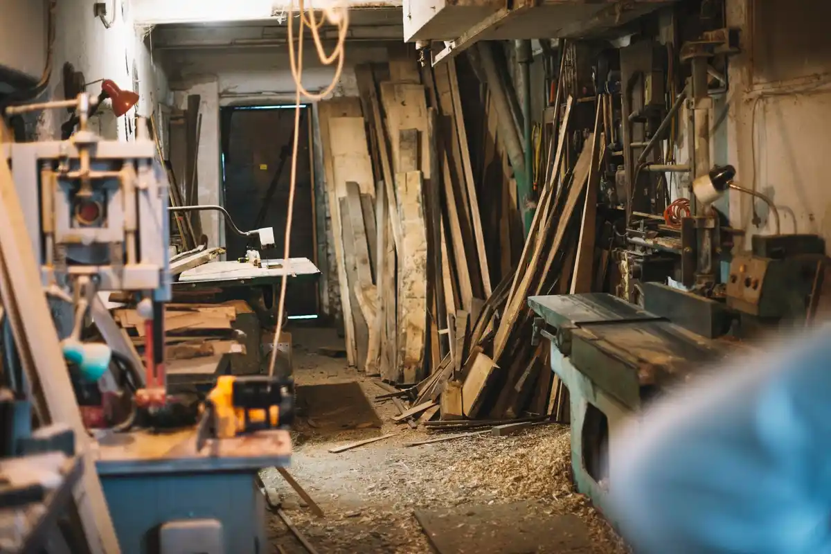 rusty garden tools in messy shed