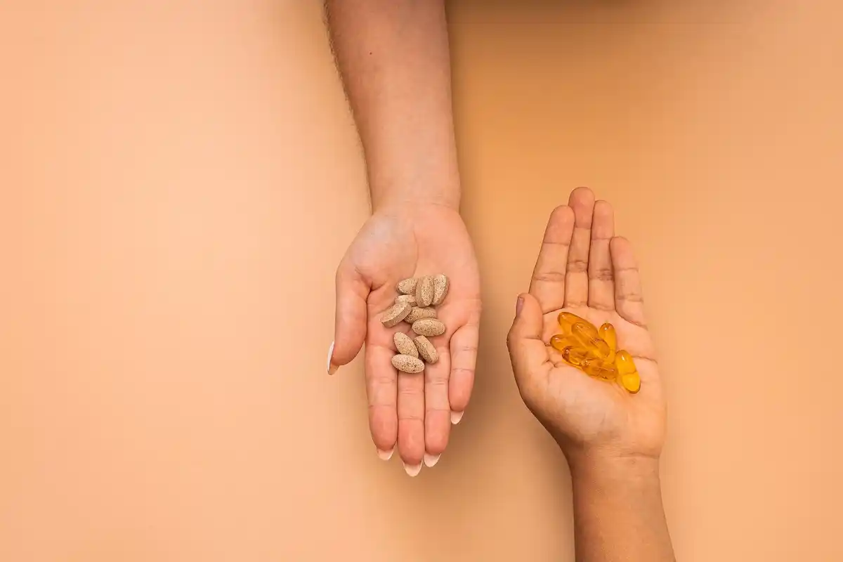 hands holding old vegetable seeds