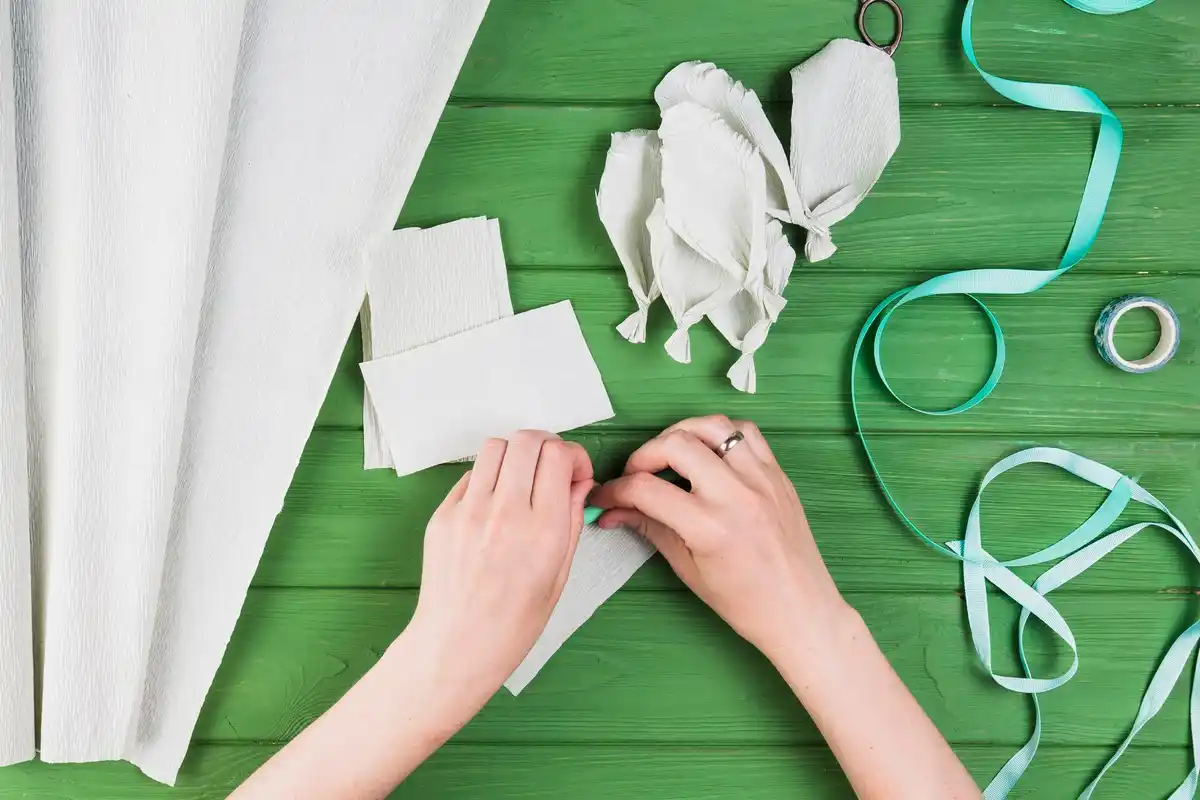 hand cutting fabric with vintage tailor scissors